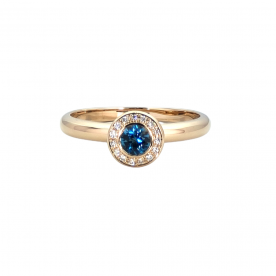 Rose gold ring with diamonds and London blue topaz